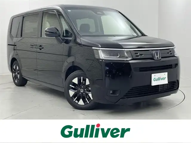 ホンダ ステップワゴン eHEV エアー EX 茨城県 2025(令7)年 0.1千km クリスタルブラックパール 11.4インチナビHonda CONNECTナビ /Bluetooth/フルセグ/CD/DVD/radio/SD/ホンダセンシング/・衝突被害軽減ブレーキ/・誤発進抑制/・路外逸脱抑制機能/・渋滞追従機能付きアダプティブクルーズコントロール/・標識認識機能/・オートハイビーム/・ブラインドスポットインフォメーション/LEDアクティブコーナリングライト/バックカメラ/パワーバックドア/D+N席シートヒーター/2列目オットマン/フルLEDヘッドライト/車輛接近通報機能