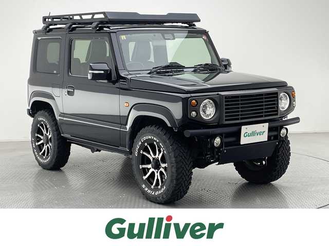 スズキ ジムニー XC 兵庫県 2018(平30)年 5.5万km ブルーイッシュブラックパール3 ワンオーナー/ルーフキャリア/社外パイプバンパー/スロットルコントローラー Pivot 3-drive・EVO/Greddy ブローオフバルブ/イエローフォグ/スズキセーフティサポート/・デュアルセンサーブレーキサポート/・車線逸脱警報機能/・誤発進抑制機能/・クルーズコントロール/プッシュスタート/社外ナビ/フルセグTV/バックカメラ/ETC/レザー調シートカバー/シートヒーター/LEDヘッドライト/オートライト/16インチ RAYS TEAM DAYTONA アルミホイール