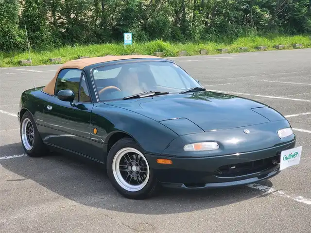ユーノス ロードスター Vスペシャル 福岡県 1992(平4)年 9.2万km 緑 社外CDステレオ/（Bluetooth、UBS入力）/ナルディ製ステアリング/ナルディ製シフトノブ/ウッドサイドブレーキノブ/Vスペシャルフロアマット/社外14インチアルミホイール/TEIN減衰力調整付車高調/・MAQｓスプリング（70.180.10）/　に組み替え済み/・TEINスプリングは車内積込み/リアスクリーン（ガラス製）/ボディーカバー（車内積み）/泥よけ（車内積み）/トノカバー（車内積み）/取扱説明書/ETC