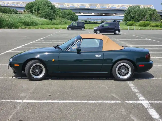 ユーノス ロードスター Vスペシャル 福岡県 1992(平4)年 9.2万km 緑 社外CDステレオ/（Bluetooth、UBS入力）/ナルディ製ステアリング/ナルディ製シフトノブ/ウッドサイドブレーキノブ/Vスペシャルフロアマット/社外14インチアルミホイール/TEIN減衰力調整付車高調/・MAQｓスプリング（70.180.10）/　に組み替え済み/・TEINスプリングは車内積込み/リアスクリーン（ガラス製）/ボディーカバー（車内積み）/泥よけ（車内積み）/トノカバー（車内積み）/取扱説明書/ETC
