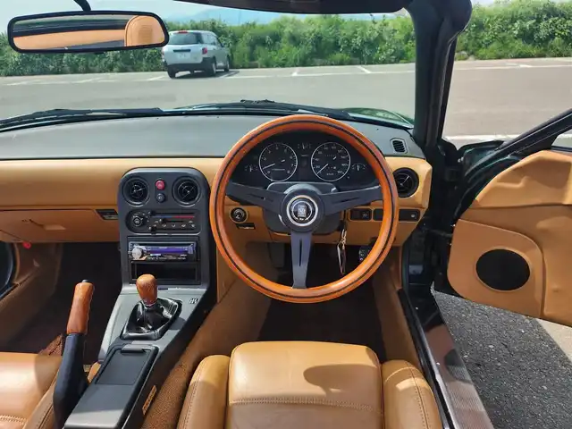 ユーノス ロードスター Vスペシャル 福岡県 1992(平4)年 9.2万km 緑 社外CDステレオ/（Bluetooth、UBS入力）/ナルディ製ステアリング/ナルディ製シフトノブ/ウッドサイドブレーキノブ/Vスペシャルフロアマット/社外14インチアルミホイール/TEIN減衰力調整付車高調/・MAQｓスプリング（70.180.10）/　に組み替え済み/・TEINスプリングは車内積込み/リアスクリーン（ガラス製）/ボディーカバー（車内積み）/泥よけ（車内積み）/トノカバー（車内積み）/取扱説明書/ETC