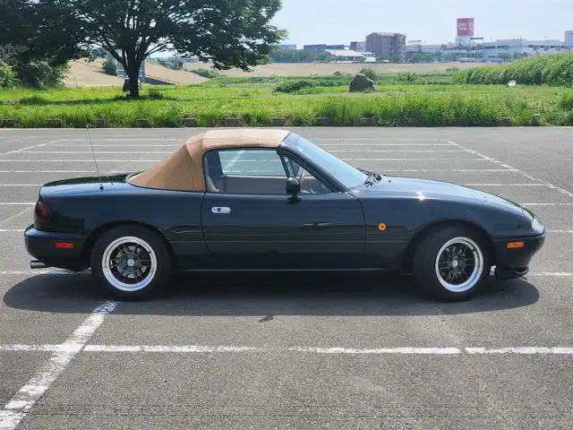 ユーノス ロードスター Vスペシャル 福岡県 1992(平4)年 9.2万km 緑 社外CDステレオ/（Bluetooth、UBS入力）/ナルディ製ステアリング/ナルディ製シフトノブ/ウッドサイドブレーキノブ/Vスペシャルフロアマット/社外14インチアルミホイール/TEIN減衰力調整付車高調/・MAQｓスプリング（70.180.10）/　に組み替え済み/・TEINスプリングは車内積込み/リアスクリーン（ガラス製）/ボディーカバー（車内積み）/泥よけ（車内積み）/トノカバー（車内積み）/取扱説明書/ETC