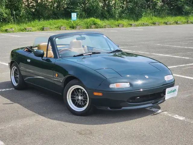 ユーノス ロードスター Vスペシャル 福岡県 1992(平4)年 9.2万km 緑 社外CDステレオ/（Bluetooth、UBS入力）/ナルディ製ステアリング/ナルディ製シフトノブ/ウッドサイドブレーキノブ/Vスペシャルフロアマット/社外14インチアルミホイール/TEIN減衰力調整付車高調/・MAQｓスプリング（70.180.10）/　に組み替え済み/・TEINスプリングは車内積込み/リアスクリーン（ガラス製）/ボディーカバー（車内積み）/泥よけ（車内積み）/トノカバー（車内積み）/取扱説明書/ETC