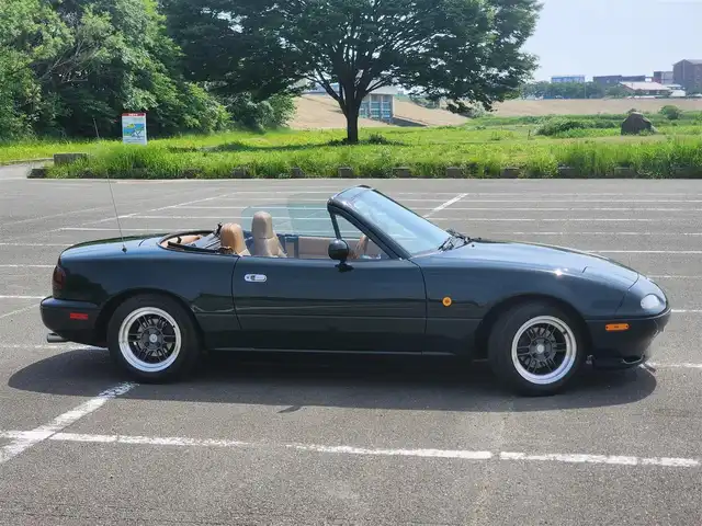 ユーノス ロードスター Vスペシャル 福岡県 1992(平4)年 9.2万km 緑 社外CDステレオ/（Bluetooth、UBS入力）/ナルディ製ステアリング/ナルディ製シフトノブ/ウッドサイドブレーキノブ/Vスペシャルフロアマット/社外14インチアルミホイール/TEIN減衰力調整付車高調/・MAQｓスプリング（70.180.10）/　に組み替え済み/・TEINスプリングは車内積込み/リアスクリーン（ガラス製）/ボディーカバー（車内積み）/泥よけ（車内積み）/トノカバー（車内積み）/取扱説明書/ETC
