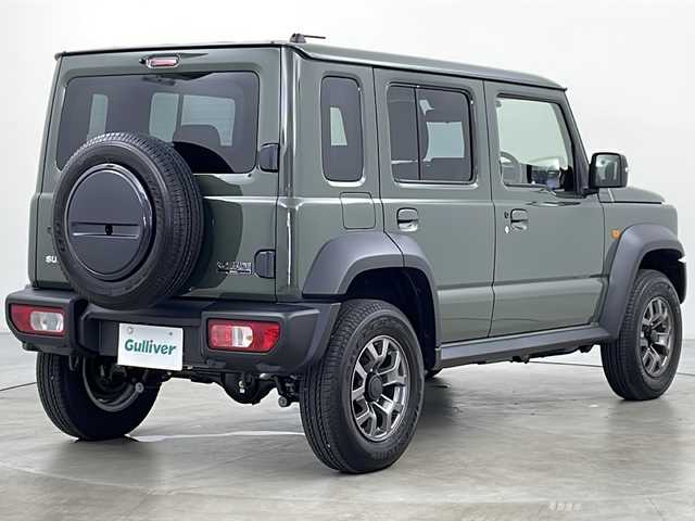 スズキ ジムニー ノマド FC 道央・札幌 2025(令7)年 0.2万km ＤグリーンＭ ・4WD/・社外ディスプレイオーディオ　BT/・バックカメラ/・スマートキー/・プッシュスタート/・スズキセーフティーサポート/・衝突被害軽減ブレーキ/・先行車発進お知らせ/・標識認識機能/・車線逸脱警報/・ふらつき警報/・前後誤発進抑制機能/・アートマチックハイビーム/・ダウンヒルアシストコントロール/・アイドリングストップ/・シートヒーターDN席/・ミラーヒーター/・ビルトインETC/・オートライト/・LEDヘッドライト/・フォグ/・ヘットライトウオッシャー