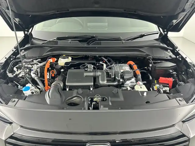 ホンダ ヴェゼル ハイブリッド e:HEV Z 愛知県 2025(令7)年 0.1千km クリスタルブラックパール 登録済未使用車/純正9インチナビ/（AM/FM/フルセグTV/Bluetooth）/バックカメラ/ワイヤレス充電/ホンダセンシング/・衝突軽減ブレーキ/・レーンキープアシスト/・レーダークルーズコントロール/・オートマチックハイビーム/・クリアランスソナー/ブラインドスポットモニター/ETC2.0/シートヒーター/ステアリングヒーター/チップアップシート/ハーフレザー/パドルシフト/パワーバックドア/スマートキー/プッシュスタート/LEDヘッドライト/フロントフォグランプ/ダウンヒルアシスト/純正アルミホイール/横滑り防止装置/電動格納ミラー/ステアリングスイッチ