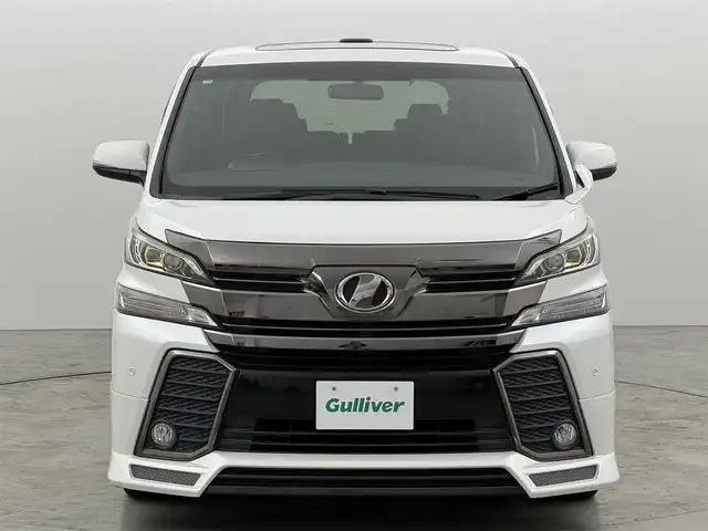 トヨタ ヴェルファイア Z Aエディション 福岡県 2016(平28)年 5.8万km ホワイトパールクリスタルシャイン モデリスタフロントエアロ　/ツインサンルーフ　/純正９型ナビ　/クルーズコントロール　/コーナーセンサー　/両側電動スライドドア　/電動リアゲート　/ビルトインＥＴＣ２．０　/オットマン　/１００ボルト電源　/Ｗエアコン