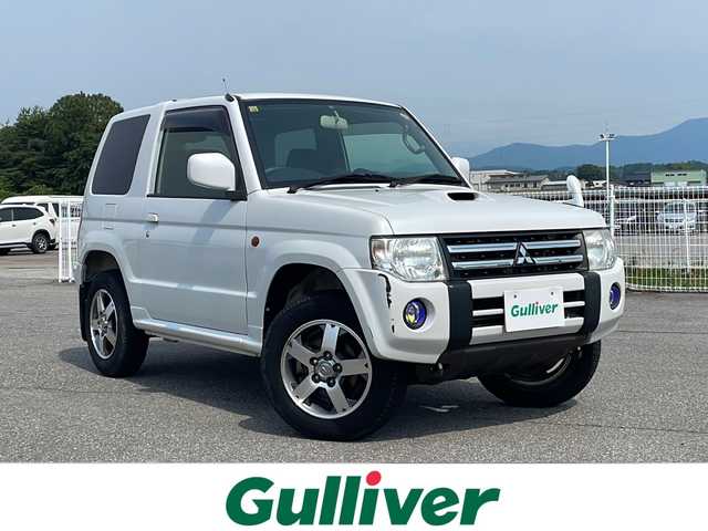 三菱 パジェロ ミニ VR 富山県 2012(平24)年 3.3万km シルキーホワイト ４WD/社外SDナビ(NX711)/フルセグTV/BT・CD・DVD/バックカメラ/純正スピーカー　/背面タイヤ/純正AW/純正フロアマット/シートヒーター/ETC/リモコンキー/保証書・記録簿/取扱説明書