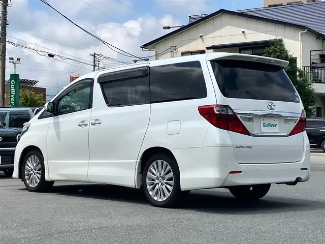 トヨタ アルファード 240S Cパッケージ 静岡県 2012(平24)年 5.7万km ホワイトパールクリスタルシャイン 純正HDDナビ（CD/DVD/BT/フルセグ）/バックカメラ/純正後席用モニター/電動リアゲート/D席N席パワーシート/ETC/２列目電動リクライニングシート/２列目電動オットマン/N席電動オットマン/三列シート/ウォークスルー/純正フロアマット/純正アルミホイール/エンジンスタートボタン/パワーステアリング/パワーウィンドウ/Wオートエアコン/スマートキー/スペアキー１本/クルーズコントロール/両側パワースライドドア/コーナーセンサー前後/ABS/横滑り防止装置/オートライト/W＋サイドエアバック/カーテンエアバック