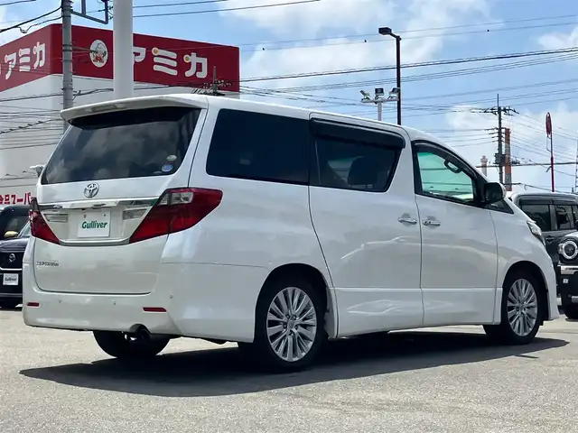 トヨタ アルファード 240S Cパッケージ 静岡県 2012(平24)年 5.7万km ホワイトパールクリスタルシャイン 純正HDDナビ（CD/DVD/BT/フルセグ）/バックカメラ/純正後席用モニター/電動リアゲート/D席N席パワーシート/ETC/２列目電動リクライニングシート/２列目電動オットマン/N席電動オットマン/三列シート/ウォークスルー/純正フロアマット/純正アルミホイール/エンジンスタートボタン/パワーステアリング/パワーウィンドウ/Wオートエアコン/スマートキー/スペアキー１本/クルーズコントロール/両側パワースライドドア/コーナーセンサー前後/ABS/横滑り防止装置/オートライト/W＋サイドエアバック/カーテンエアバック