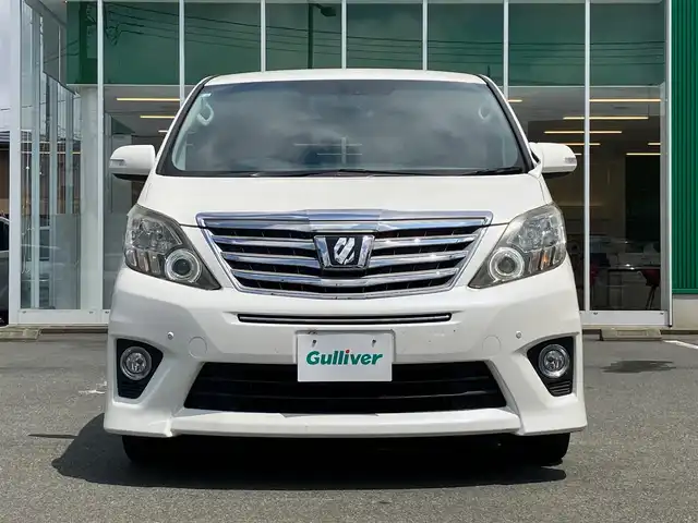 トヨタ アルファード 240S Cパッケージ 静岡県 2012(平24)年 5.7万km ホワイトパールクリスタルシャイン 純正HDDナビ（CD/DVD/BT/フルセグ）/バックカメラ/純正後席用モニター/電動リアゲート/D席N席パワーシート/ETC/２列目電動リクライニングシート/２列目電動オットマン/N席電動オットマン/三列シート/ウォークスルー/純正フロアマット/純正アルミホイール/エンジンスタートボタン/パワーステアリング/パワーウィンドウ/Wオートエアコン/スマートキー/スペアキー１本/クルーズコントロール/両側パワースライドドア/コーナーセンサー前後/ABS/横滑り防止装置/オートライト/W＋サイドエアバック/カーテンエアバック