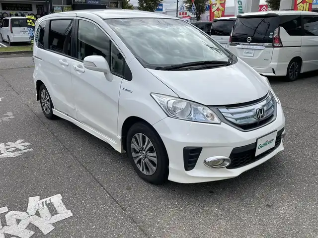 ホンダ フリード ハイブリット ジャストセレクション 新潟県 2013(平25)年 9.6万km プラチナホワイトパール メモリナビ/ワンセグテレビ/バックカメラ/純正ホイール夏タイヤ装着/スタッドレスタイヤ車載/ウィンカーミラー/クルーズコントロール/ETC/両側パワースライドドア/ECON/ステアリングスイッチ/スペアキー個