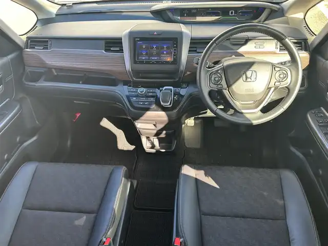 ホンダ フリード ハイブリット クロスター 大阪府 2023(令5)年 1.2万km クリスタルブラックパール 純正ナビ　/・フルセグTV/USB/BT/DVD/ホンダセンシング　/バックカメラ　/前後ドライブレコーダー /ビルトインETC /両側パワースライドドア /D/N席シートヒーター/ハーフレザーシート /LEDヘッド /純正15インチAW /純正フロアマット/カーテンエアバック/スペアキー/保証書・取説