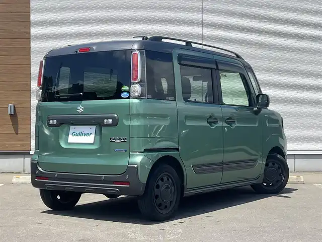 スズキ スペーシア ギア HYBRID XZターボ 秋田県 2019(令1)年 4.1万km ツールグリーンパールメタリック/ガンメタリック2トーンルーフ 社外ナビ/衝突軽減システム/両側パワスラ/ターボ/純正アルミ/LEDヘッドライト/４WD/フルセグ/バックカメラ/スマートキー/アイドリングストップ/クルーズコントロール/レーンキープアシスト/パーキングアシスト/コーナーセンサー/前席シートヒーター/ルーフレール/オートマチックハイビーム/パドルシフト/ステアリングスイッチ/ETC/純正フロアマット/純正ドアバイザー/オートライト/オートエアコン/パワーステアリング/パワーウィンドウ/電動格納ウィンカーミラー/横滑り防止/盗難防止装置/保証書/取扱説明書/記録簿