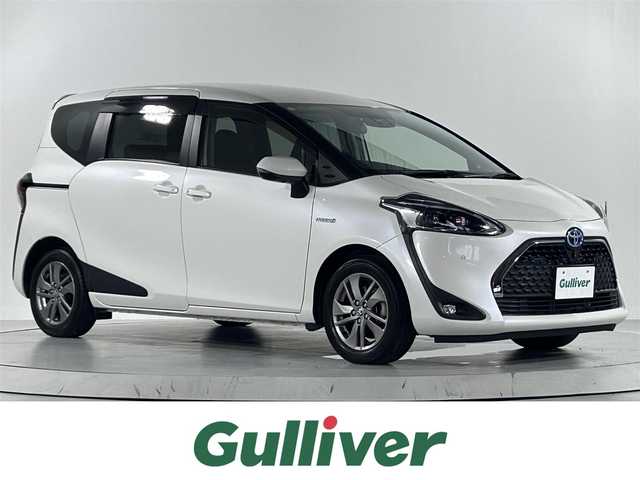 トヨタ シエンタ ハイブリッド G クエロ 佐賀県 2019(平31)年 2.1万km ホワイトパールクリスタルシャイン ワンオーナー/ディーラーOP純正9インチナビ/CD/DVD/Bluetooth/HDMI/フルセグTV/パノラミックビューモニター/ハーフレザーシート/シートヒーター＜運転席/助手席＞/ステアリングヒーター/Toyota Safety Sense /・プリクラッシュセーフティシステム/（レーザーレーダー＋単眼カメラ方式）/・レーンディパーチャーアラート/・オートマチックハイビーム/クリアランスソナー/ステアリングスイッチ/ナビ連動ドライブレコーダー/USB充電ポート/ビルドインETC/スマートキー/スペアキー/純正16インチアルミホイール