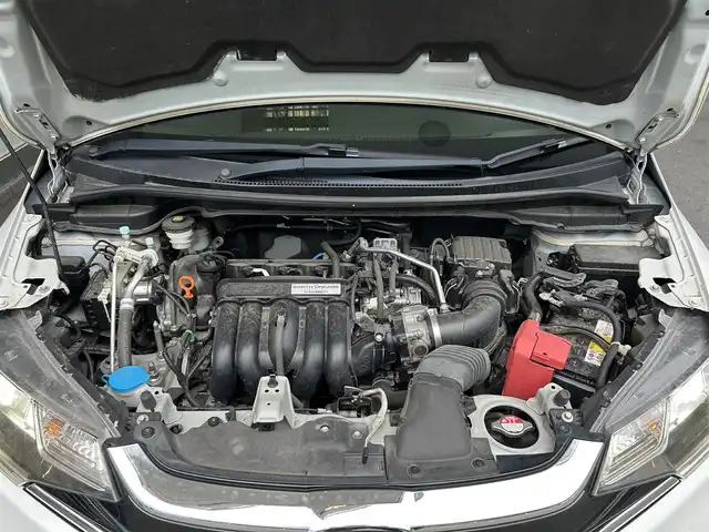 ホンダ フィット 13G L ホンダセンシング 福島県 2018(平30)年 8.3万km プラチナホワイトパール 登録時走行距離：８３/０７５ｋｍ/ワンオーナー/純正SDナビ/（FM/AM/CD/DVD/BT接続）/ETC/クルーズコントロール/電格ミラー/LEDヘッドライト/フォグランプ/純正フロアマット/社外AW/横滑り防止装置/衝突被害軽減ブレーキ/保証書/取扱説明書