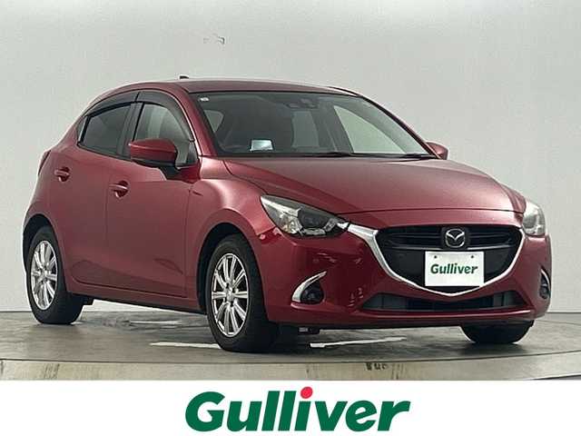 マツダ デミオ 13S ツーリング 愛知県 2017(平29)年 11万km ソウルレッドプレミアムメタリック 禁煙車/純正7インチナビ/（CD/DVD/Bluetooth/フルセグTV/Bluetooth)/バックカメラ/i-ACTIVESENSE/・衝突軽減ブレーキ/・レーダークルーズコントロール/・レーンキープアシスト/・オートマチックハイビーム/・コーナーセンサー/ヘッドアップディスプレイ/ETC/ドライブレコーダー/シートヒーター/純正15インチアルミホイール/LEDヘッドライト/フロントフォグランプ/スマートキー/プッシュスタート/純正フロアマット/アイドリングストップ/横滑り防止装置