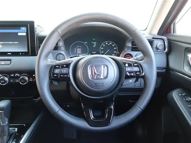 ホンダ ヴェゼル ハイブリッド e:HEV Z 石川県 2025(令7)年 0.3万km プレミアムクリスタルレッドM プッシュスタート/スマートキー2本/アクティブクルーズコントロール/ステアリングヒーター/パーキングセンサー/ハンズフリーアクセスパワーゲート/パドルシフト/ビルトインETC/Fシートヒーター/FRソナーセンサー/黒ハーフレザーシート/ヒルディセントコントロール/アダプティブドライビングビーム/ドアバイザー/Fフォグランプ/純正フロアマット