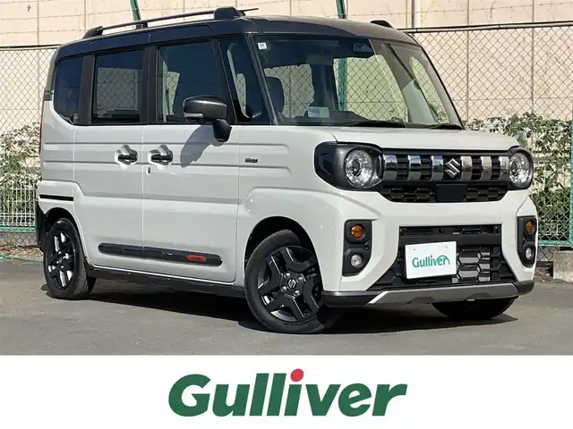 スズキ スペーシア ギア HYBRID XZターボ 東京都 2024(令6)年 1万km ベージュⅡ ワンオーナー　/純正９型メモリナビ＆フルセグ /・BluetoothAudio/・AppleCarPlay＆AndroidAuto/ヘッドアップディスプレィ /アラウンドビューモニター /両側パワースライドドア　/前席シートヒーター /ステアリングヒーター /セーフティサポート /（予防安全技術）/・デュアルカメラブレーキサポート２/・誤発進抑制機能/・低速時ブレーキホールド/・車線逸脱警報機能/・アダプティブクルーズコントロール/・標識認識機能/・発進お知らせ機能/LEDヘッドライト /Wエアバック＆ABS/保証書＆取説