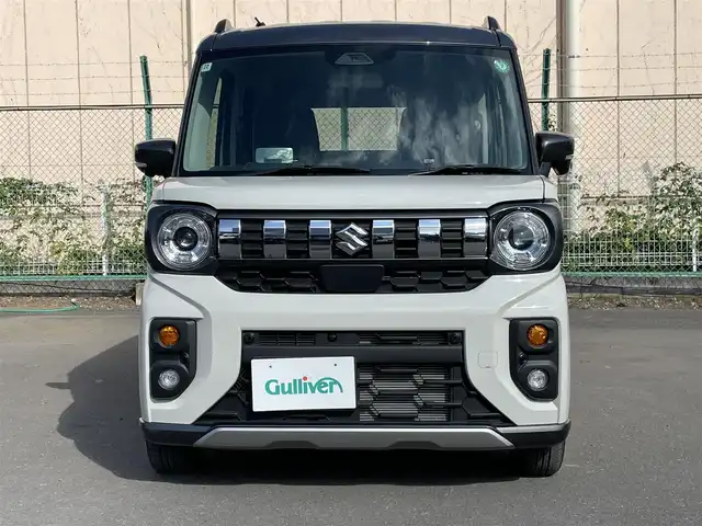 スズキ スペーシア ギア HYBRID XZターボ 東京都 2024(令6)年 1万km ベージュⅡ ワンオーナー　/純正９型メモリナビ＆フルセグ /・BluetoothAudio/・AppleCarPlay＆AndroidAuto/ヘッドアップディスプレィ /アラウンドビューモニター /両側パワースライドドア　/前席シートヒーター /ステアリングヒーター /セーフティサポート /（予防安全技術）/・デュアルカメラブレーキサポート２/・誤発進抑制機能/・低速時ブレーキホールド/・車線逸脱警報機能/・アダプティブクルーズコントロール/・標識認識機能/・発進お知らせ機能/LEDヘッドライト /Wエアバック＆ABS/保証書＆取説