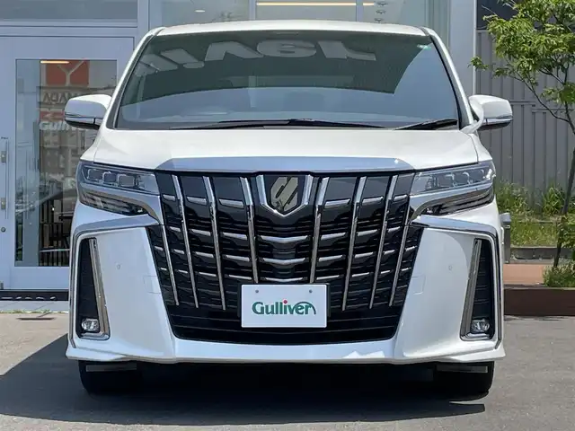 トヨタ アルファード S タイプゴールド 道央・札幌 2021(令3)年 3.8万km ホワイトパールクリスタルシャイン ・４WD/・衝突軽減ブレーキ/・純正ナビ/　CD＆DVD＆BT＆TV/・バックカメラ/・パワーバックドア/・両側パワースライドドア/・ハーフレザーシート/・アイドリングストップ/・レーンキープアシスト/・コーナーセンサー/・レーダークルーズコントロール/・オートエアコン/・オートライト/・デジタルインナーミラー/・ブラインドスポットモニター/・オートリトラミラー/・オートハイビーム/・ビルトインETC/・MT付きAT/・三眼LEDライト/・純正フロアマット/・ウィンカーミラー/・フォグライト/・スペアキー