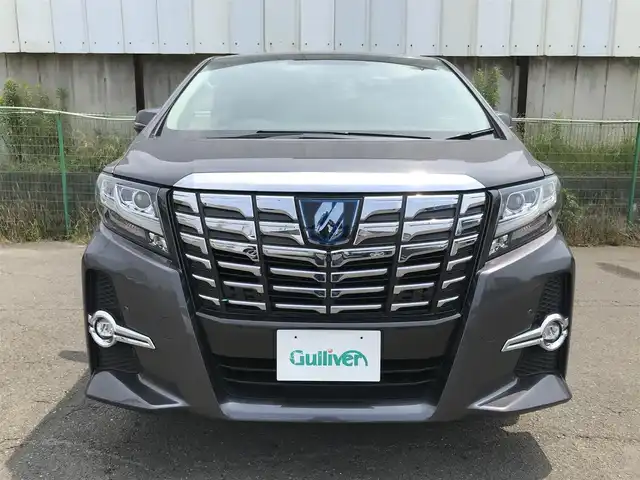 トヨタ アルファードハイブリット SR 秋田県 2016(平28)年 8万km グレーメタリック 4WD/純正9.2型メーカーOPナビ/　(Bluetooth/DVD/Blu-ray)/フルセグTV/両側パワースライドドア/パワーバックドア/パノラミックビューモニター/ビルトインETC/純正12.1型リアエンターテインメントシステム/レーダークルーズコントロール/インテリジェントクリアランスソナー/プリクラッシュセーフティシステム/ビークルスタビリティコントロール/LEDヘッドランプ/オートライト/デュアルオートエアコン/木目調/革巻きコンビステアリング/合皮/ファブリックコンビシート/前席パワーシート/2列目リラックスキャプテンシート/運転席ポジションメモリー/助手席パワーオットマン/純正17インチアルミホイール/スマートエントリー/プッシュスタートシステム/JBLプレミアムサウンドシステム/バルミナ17インチAWスタッドレス積込/禁煙車