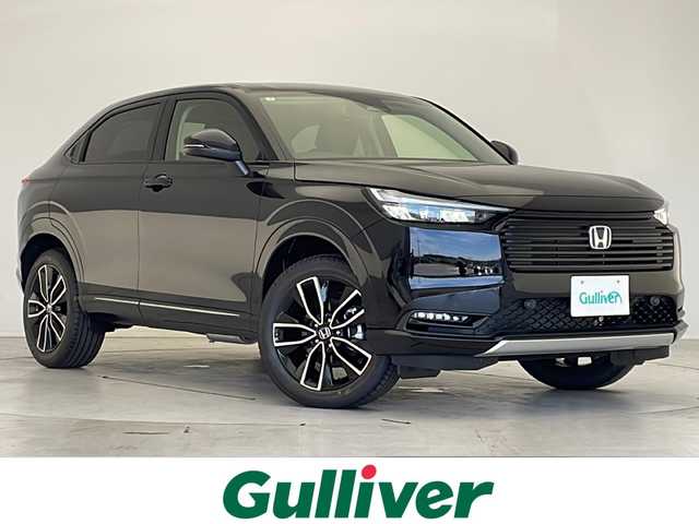 ホンダ ヴェゼル ハイブリッド e:HEV Z 愛知県 2025(令7)年 0.1千km クリスタルブラックパール 登録済未使用車/衝突軽減システム/純正9型ディズプレイオーディオ　ナビ機能あり/レーダークルーズコントロール/シートヒーター/Bluetooth/バックカメラ/電動リアゲート/コーナーセンサー/純正アルミホイール/ETC2.0/ブラインドスポットモニター/LEDヘッドライト/パドルシフト/オートライト/置くだけ充電機/ステアリングスイッチ/スマートキー/プッシュスタート