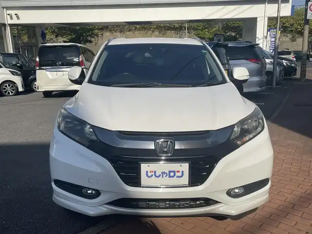 ホンダ ヴェゼル ハイブリッド Z 福岡県 2015(平27)年 10.3万km ホワイトオーキッドパール (株)IDOMが運営する【じしゃロン八幡西店】の自社ローン専用車両になります。こちらは現金またはオートローンご利用時の価格です。自社ローンご希望の方は別途その旨お申付け下さい/スマートキー/純正メモリナビ/Bluetooth/フルセグ/バックカメラ/クルーズコントロール/パドルシフト/シートヒーター/ETC