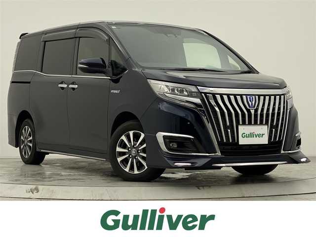 トヨタ エスクァイア ハイブリッド Gi プレミアムパッケージ 宮城県 2019(平31)年 2.8万km ブラッキッシュアゲハガラスフレーク 純正9インチナビ/（NSZT-Y68T)/純正フリップダウンモニター/純正OPエアロ/安全装備/・衝突被害軽減システム/・横滑り防止装置/・レーンキープアシスト/アイドリングストップ/クルーズコントロール/ETC/スマートキー/バックカメラ/フルセグテレビ/USB入力端子/ハーフレザー/シートヒーター/両側パワースライド/コーナーセンサー/ドライブレコーダー