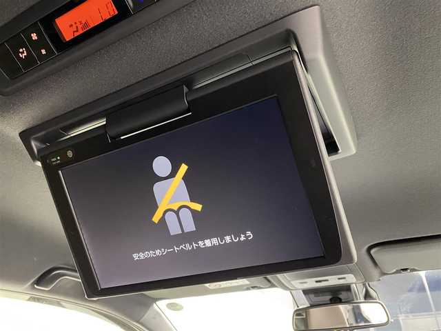 トヨタ エスクァイア ハイブリッド Gi プレミアムパッケージ 宮城県 2019(平31)年 2.8万km ブラッキッシュアゲハガラスフレーク 純正9インチナビ/（NSZT-Y68T)/純正フリップダウンモニター/純正OPエアロ/安全装備/・衝突被害軽減システム/・横滑り防止装置/・レーンキープアシスト/アイドリングストップ/クルーズコントロール/ETC/スマートキー/バックカメラ/フルセグテレビ/USB入力端子/ハーフレザー/シートヒーター/両側パワースライド/コーナーセンサー/ドライブレコーダー