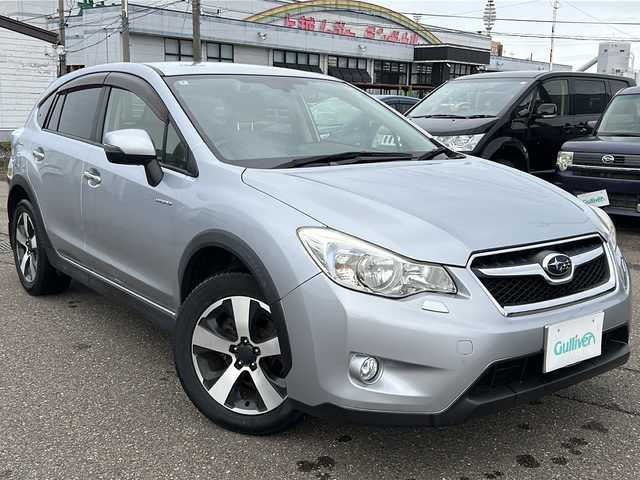 スバル インプレッサ ＸＶ ハイブリッド 2．0i－L アイサイト 新潟県 2014(平26)年 8.7万km アイスシルバーメタリック ４WD/SDナビ(CN-R300WD)/DTV/CD/DVD/iPod/HDMI/2.0i-L　EyeSight/・全車速追従機能付クルーズコントロール/・プリクラッシュブレーキ/・ツーリングアシスト/・AT誤発進抑制制御/・後退時ブレーキアシスト/・雨滴感知オートワイパー/・オートライト/・左右独立温度調整機能付きフルオートエアコン/パドルシフト/前席パワーシート/純正フロアマット/スマートキー/スペアキー/保証書/取説