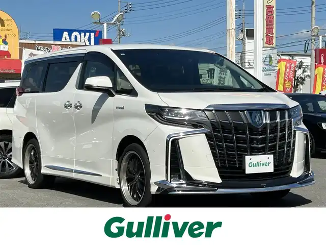 トヨタ アルファードハイブリット SR Cパッケージ 群馬県 2020(令2)年 4.1万km ホワイトパールクリスタルシャイン ４WD/モデリスタエアロ/JBLプレミアムサウンド/メーカーOP10.5型SDナビ/13.3型リヤエンターテインメントシステム/パノラミックビューモニター/デジタルインナーミラー/寒冷地仕様/三眼フルLEDライト/両側パワースライドドア/パワーバックドア/エグゼクティブパワーシート/トヨタセーフティセンス/プリクラッシュセーフティ/レーダークルーズコントロール/レーントレーシングアシスト/ロードサインアシスト/アダプティブハイビームアシスト/クリアランスソナー/パワーシート/シートヒーター・シートベンチレーション（前席）/ステアリングヒーター/ロールサンシェード/AC100V/1500W/ビルトインETC2.0/前後ドライブレコーダー/純正エンジンスターター/社外アルミホイール/TVキット
