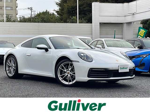 ポルシェ ポルシェ ９１１ カレラ 東京都 2024(令6)年 0.5万km ピュアホワイト 新車時保証書　整備記録簿/取扱説明書　/ブレーキアシスト/レーンキープアシスト/純正ナビ/社外フルセグTV/BT/USB/AppleCarplay/社外DVDプレイヤー/360度カメラ　ETC【2.0】/ドライブレコーダー【３６０度＋前後】/レザーシート/シートヒーター/フロント背もたれパワーシート/キーレスキー×２/LEDヘッドライト/オートライト/パドルシフト付皮巻きハンドル/純正19インチアルミ【フロント】/純正２０インチアルミ【リヤ】