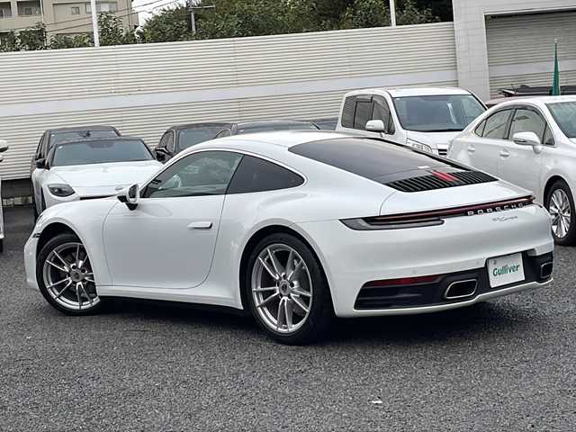 ポルシェ ポルシェ ９１１ カレラ 東京都 2024(令6)年 0.5万km ピュアホワイト 新車時保証書　整備記録簿/取扱説明書　/ブレーキアシスト/レーンキープアシスト/純正ナビ/社外フルセグTV/BT/USB/AppleCarplay/社外DVDプレイヤー/360度カメラ　ETC【2.0】/ドライブレコーダー【３６０度＋前後】/レザーシート/シートヒーター/フロント背もたれパワーシート/キーレスキー×２/LEDヘッドライト/オートライト/パドルシフト付皮巻きハンドル/純正19インチアルミ【フロント】/純正２０インチアルミ【リヤ】