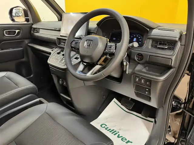 ホンダ ステップワゴン スパーダ eHEV 群馬県 2025(令7)年 0.1万km クリスタルブラックパール ホンダセンシング/・衝突軽減ブレーキ/・誤発進抑制機能/・歩行者事故低減ステアリング/・車線維持支援システム/・路外逸脱抑制機能/・標識認識機能/・先行車発進お知らせ機能/・アダプティブクルーズコントロール/・後方誤発進抑制機能/・近距離衝突軽減ブレーキ/・トラフィックジャムアシスト/・ブラインドスポットインフォメーション/・オートハイビーム/・アダプティブドライビングビーム/社外11インチナビ/・フルセグTV/・Bluetooth/・AUX/パワーバックドア/両側電動スライドドア/ハーフレザーシート/前席シートヒーター/パドルシフト/革巻きステアリング/ステアリングスイッチ/USBポート/スマートキー/プッシュスタート/LEDヘッドライト/フォグランプ/オートライト/ヘッドライトレベライザー/純正16インチAW/電動格納ウィンカーミラー