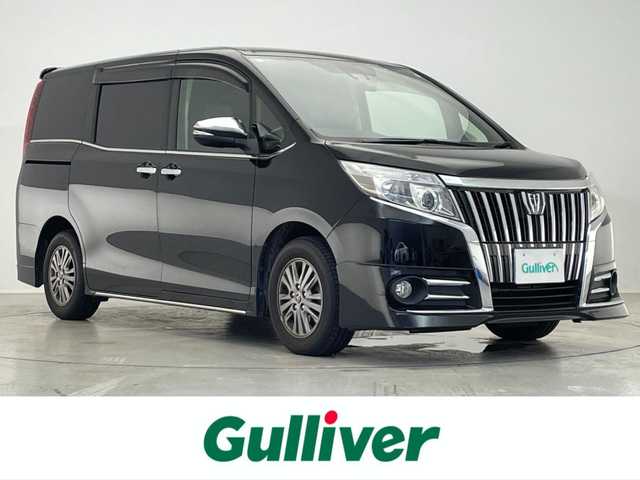 トヨタ エスクァイア Gi 滋賀県 2016(平28)年 3.7万km ブラック 純正９インチナビ/・フルセグTV・Bluetooth・CD・DVD・SD/後席用モニター/バックカメラ/前後ドライブレコーダー/ビルトインETC/両側パワースライドドア/衝突軽減機能/横滑り防止機能/オートハイビーム/オートライト/LEDヘッドライト/レザーシート/シートヒーター/電動格納ミラー