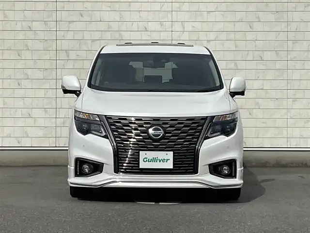 日産 エルグランド 350HWS アーバンクロム 福岡県 2021(令3)年 3.8万km ピュアホワイトパール 純正10型SDナビ(フルセグTV/CD/DVD/BT)/全方位/コーナーセンサー/ブラインドスポット/Wサンルーフ/後席フリップダウンモニター/クルコン/助手席オットマン/ドラレコ/電動リア/ETC/デジタルインナーミラー/USB/純正フロアマット/純正LED/純正アルミホイール/プッシュスタート/スペアキー