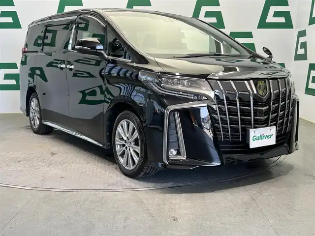 トヨタ アルファード S タイプゴールドⅡ 鹿児島県 2021(令3)年 6.4万km ブラック トヨタセーフティセンス/・プリクラッシュセーフティ/・レーントレーシングアシスト/・全車速追従機能付レーダークルーズコントロール/・ロードサインアシスト/・オートマチックハイビーム/・先行車発進告知機能/純正フリップダウンモニター【V12T-R68C】/純正9インチディスプレイオーディオ/（CD/DVD/Bluetooth/スマホ連携）/CD・DVDデッキ/AC100V/バックカメラ/ビルトインETC/社外前後ドライブレコーダー【DC-DR652】/両側パワースライドドア/革巻きステアリング/ステアリングリモコン/ハーフレザーシート/2列目オットマン/パワーバックドア/3眼LEDヘッドライト/フロントフォグランプ/オートライト/フロント&バックソナー/純正フロアマット/純正18インチアルミ