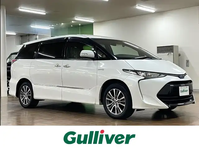 トヨタ エスティマ ハイブリッド アエラス スマート 道央・札幌 2016(平28)年 7.9万km ホワイトパールクリスタルシャイン 4WD/純正SDナビ/・フルセグTV/CD/DVD/BT/SD/バックカメラ/両側パワースライドドア/合成皮革シート/前席シートヒーター/運転席パワーシート/クルーズコントロール/ビルトインETC/衝突被害軽減ブレーキ/レーンキープアシスト/横滑り防止装置/オートマチックハイビーム/プッシュスタート/スマートキー/純正フロアマット/純正ドアバイザー/ウインカーミラー/オートライト/LEDヘッドライト/AC100V電源/2列目オットマン/3列シート/純正17インチAW/保証書/取扱説明書/ナビ説明書