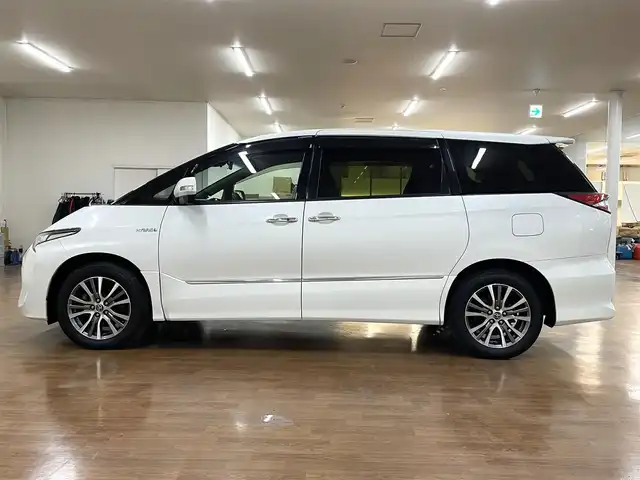 トヨタ エスティマ ハイブリッド アエラス スマート 道央・札幌 2016(平28)年 7.9万km ホワイトパールクリスタルシャイン 4WD/純正SDナビ/・フルセグTV/CD/DVD/BT/SD/バックカメラ/両側パワースライドドア/合成皮革シート/前席シートヒーター/運転席パワーシート/クルーズコントロール/ビルトインETC/衝突被害軽減ブレーキ/レーンキープアシスト/横滑り防止装置/オートマチックハイビーム/プッシュスタート/スマートキー/純正フロアマット/純正ドアバイザー/ウインカーミラー/オートライト/LEDヘッドライト/AC100V電源/2列目オットマン/3列シート/純正17インチAW/保証書/取扱説明書/ナビ説明書