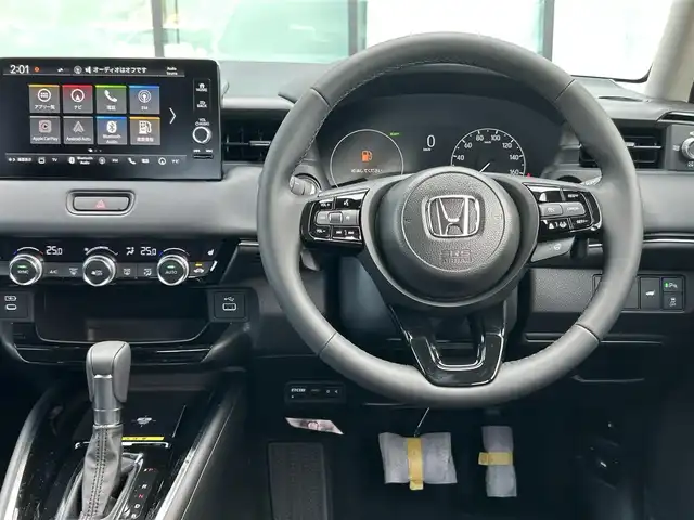 ホンダ ヴェゼル ハイブリッド e:HEV Z 香川県 2025(令7)年 0.1千km クリスタルブラックパール 登録時走行距離：3km/登録時未使用車　/ワイヤレス充電器　/純正ナビゲーション/→フルセグTV　/バックカメラ　/ＥＴＣ２．０　　/シートヒーター　/純正18インチＡＷ　/コーナーセンサー　/Ｗサイドエアバック　/カーテンエアバック　/スマートキー/スペアキー