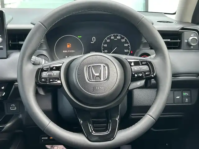 ホンダ ヴェゼル ハイブリッド e:HEV Z 香川県 2025(令7)年 0.1千km クリスタルブラックパール 登録時走行距離：3km/登録時未使用車　/ワイヤレス充電器　/純正ナビゲーション/→フルセグTV　/バックカメラ　/ＥＴＣ２．０　　/シートヒーター　/純正18インチＡＷ　/コーナーセンサー　/Ｗサイドエアバック　/カーテンエアバック　/スマートキー/スペアキー