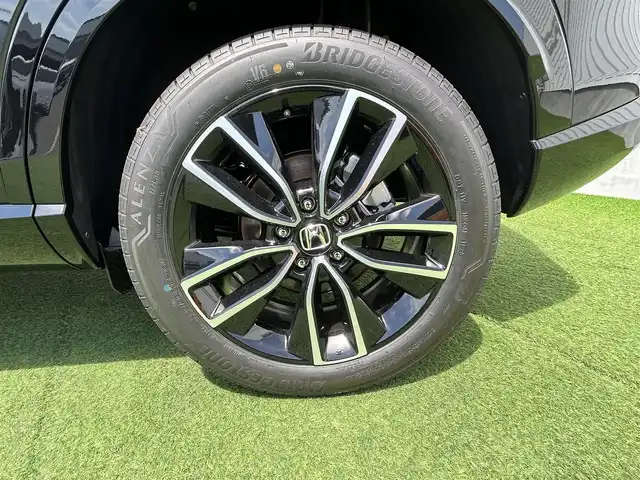 ホンダ ヴェゼル ハイブリッド e:HEV Z 香川県 2025(令7)年 0.1千km クリスタルブラックパール 登録時走行距離：3km/登録時未使用車　/ワイヤレス充電器　/純正ナビゲーション/→フルセグTV　/バックカメラ　/ＥＴＣ２．０　　/シートヒーター　/純正18インチＡＷ　/コーナーセンサー　/Ｗサイドエアバック　/カーテンエアバック　/スマートキー/スペアキー