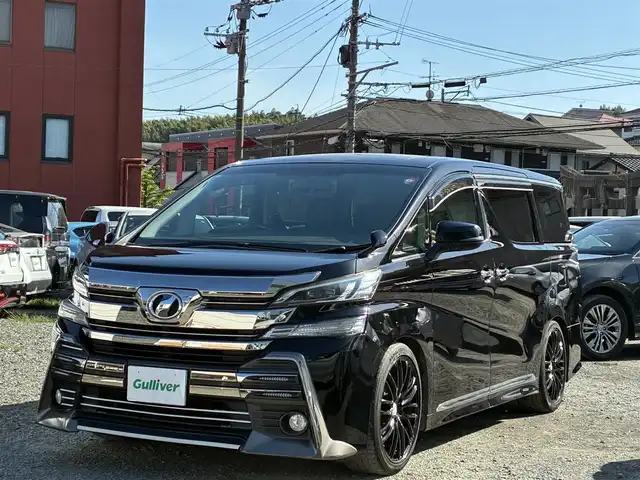 トヨタ ヴェルファイア Z 熊本県 2016(平28)年 9.3万km ブラック ALPINE専用ナビ/【フルセグTV/SD/CD/DVD/Bluetooth】/バックカメラ/ALPINEフリップダウンモニター/両側パワースライドドア/コーナーセンサー/社外20インチアルミホイール/ダウンサス/オートLEDヘッドライト/革調シートカバー/WAC/ビルトインETC/横滑り防止装置/盗難防止装置/純正フロアマット/ダブル＋サイドエアバック/プッシュスタート/スマートキー/スペアキー/三列シート/ウォークスルー/取扱説明書