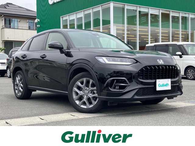 ホンダ ＺＲ－Ｖ ハイブリッド e:HEV X 静岡県 2023(令5)年 2.7万km クリスタルブラックパール エンジンスタートボタン/スマートキー/ワンオーナー/パワーステアリング/パワーウィンドウ/MTモード付AT/アイドリングストップ/オートエアコン/クルーズコントロール/全方位カメラ/ETC2.0/USB入力端子/純正ナビ（BT.フルセグ）/ドライブレコーダー前後/電動リアゲート/純正フロアマット/純正アルミホイール/ABS/横滑り防止装置/コーナーセンサー前後/レーンキープアシスト/オートライト/オートマチックハイビーム/ダウンヒルアシストコントロール/LEDヘッドライト/Wプラスサイドエアバック/カーテンエアバック/Honda SENSING/ブラインドスポットインフォメーション/後退出庫サポート/マルチビューカメラシステム/Honda CONNECTディスプレー＋ETC2.0車載器＋ワイヤレス充電器/パワーテールゲート(予約クローズ機能付)