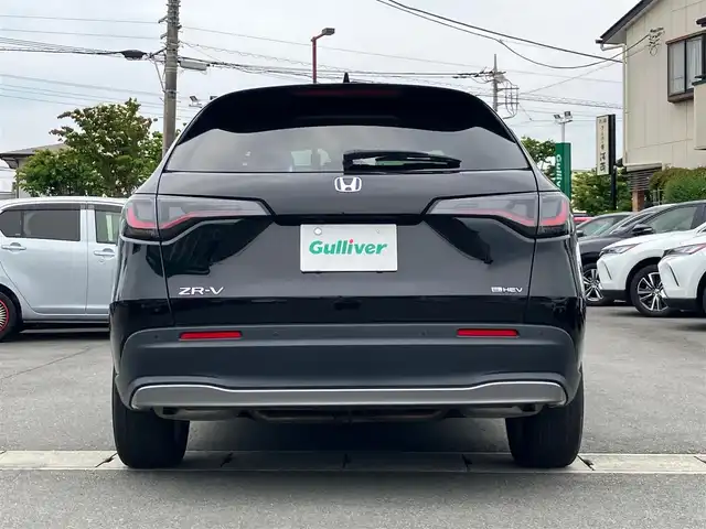 ホンダ ＺＲ－Ｖ ハイブリッド e:HEV X 静岡県 2023(令5)年 2.7万km クリスタルブラックパール エンジンスタートボタン/スマートキー/ワンオーナー/パワーステアリング/パワーウィンドウ/MTモード付AT/アイドリングストップ/オートエアコン/クルーズコントロール/全方位カメラ/ETC2.0/USB入力端子/純正ナビ（BT.フルセグ）/ドライブレコーダー前後/電動リアゲート/純正フロアマット/純正アルミホイール/ABS/横滑り防止装置/コーナーセンサー前後/レーンキープアシスト/オートライト/オートマチックハイビーム/ダウンヒルアシストコントロール/LEDヘッドライト/Wプラスサイドエアバック/カーテンエアバック/Honda SENSING/ブラインドスポットインフォメーション/後退出庫サポート/マルチビューカメラシステム/Honda CONNECTディスプレー＋ETC2.0車載器＋ワイヤレス充電器/パワーテールゲート(予約クローズ機能付)