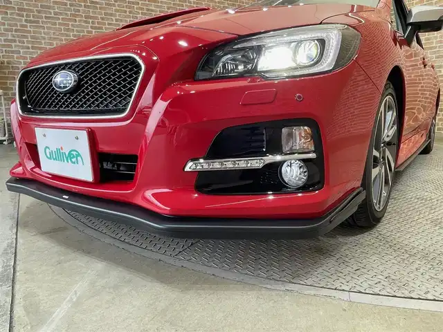 スバル レヴォーグ 1．6GT－S アイサイト 岩手県 2015(平27)年 1.7万km ピュアレッド ワンオーナー/４WD/ターボ/本革シート/STIスポイラー/STIフレキシブルタワーバー/ビルシュタインダンパー/SYMSレーシングマフラー/Blitzスロットコントローラー/パドルシフト/前席パワーシート（運転席メモリ機能付き）/前席シートヒーター/アイサイトVer.3/アドバンスドセイフティパッケージ/全車速追従機能付きクルーズコントロール/アクティブレーンキープ/プリクラッシュブレーキ/コーナーセンサー/リヤビークルディテクション/バック・サイドモニター/純正Panasonicナビ/（CD/DVD/フルセグ/SD/USB/AUX/Bluetooth）/ステアリングスイッチ/ETC/ドライブレコーダー/LEDヘッドランプ/フロント・リヤフォグランプ/純正18インチアルミホイール