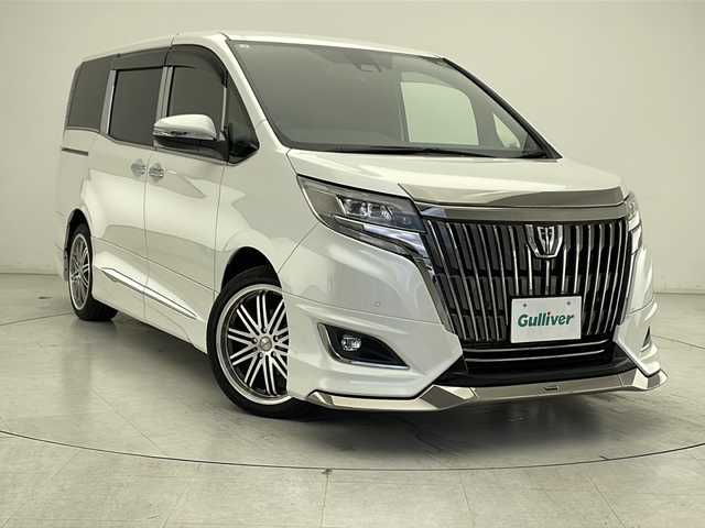 トヨタ エスクァイア Gi プレミアムパッケージ ブラックテーラード 千葉県 2021(令3)年 2.2万km ホワイトパールクリスタルシャイン 社外ナビ/　CD/DVD/Bluetooth/フルセグTV/社外フリップダウンモニター/モデリスタエアロ（F/S/R）/トヨタセーフティセンス/クルーズコントロール/車線逸脱警報/衝突軽減ブレーキ/クリアランスソナー/先行車発進警報/オートハイビーム/両側パワスラ/ハーフレザーシート/前席シートヒーター/ステアリングヒーター/LEDライト/フォグランプ/ETC/バックカメラ/前後ドラレコ/シートバックテーブル/ロールサンシェード/フロアマット/ドアバイザー