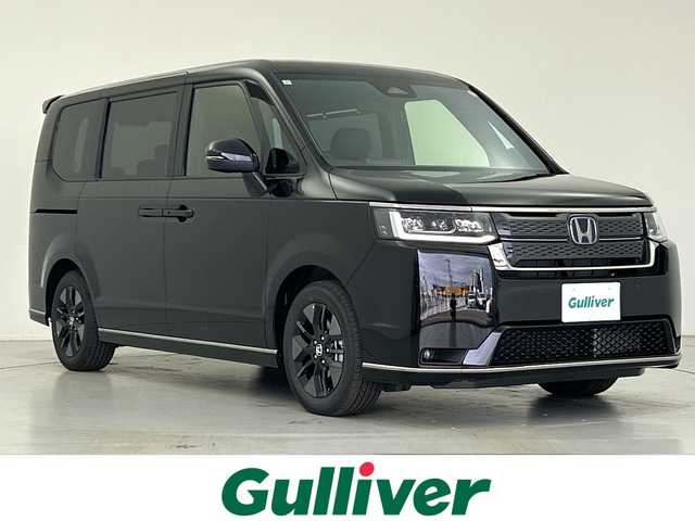 ホンダ ステップワゴン スパーダ eHEV 愛知県 2025(令7)年 0.1千km クリスタルブラックパール 登録済未使用車/11.4インチHonda CONNECTナビ(LXM-247VFLi)/・AppleCarPlay/AndroidAuto/・フルセグ/・ＨＤＭＩ入力端子/・ＵＳＢ入力端子/・Bluetooth/・CD/DVD/スペアキー１本/アダプティブクルーズコントロール/ブラインドスポットモニター/ホンダセンシング/シートヒーター/２列目オットマン/２列目キャプテンシート/全列USB Type-C チャージャー/両側パワースライドドア/パワーテールゲート/パドルシフト/取扱説明書/保証書