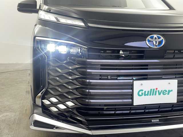 トヨタ ヴォクシー ハイブリッド S－Z 栃木県 2022(令4)年 3.3万km アティチュードブラックマイカ モデリスタフルエアロ/トヨタセーフティセンス/・プリクラッシュセーフティ/・レーンディパーチャーアラート/・オートマチックハイビーム/・レーントレーシングアラート/・発進遅れ告知機能/快適利便パッケージHi/・パワーバックドア/・2列目オットマン付きシート/・2列目シートヒーター/純正10.5インチディスプレイナビ/・CD/DVDデッキ/・フルセグTV/ブラインドスポットモニター/AC100V電源/ビルトインETC2.0/両側パワースライドドア/スマートキー/LEDヘッドライト/保証書/取扱説明書/スペアキー